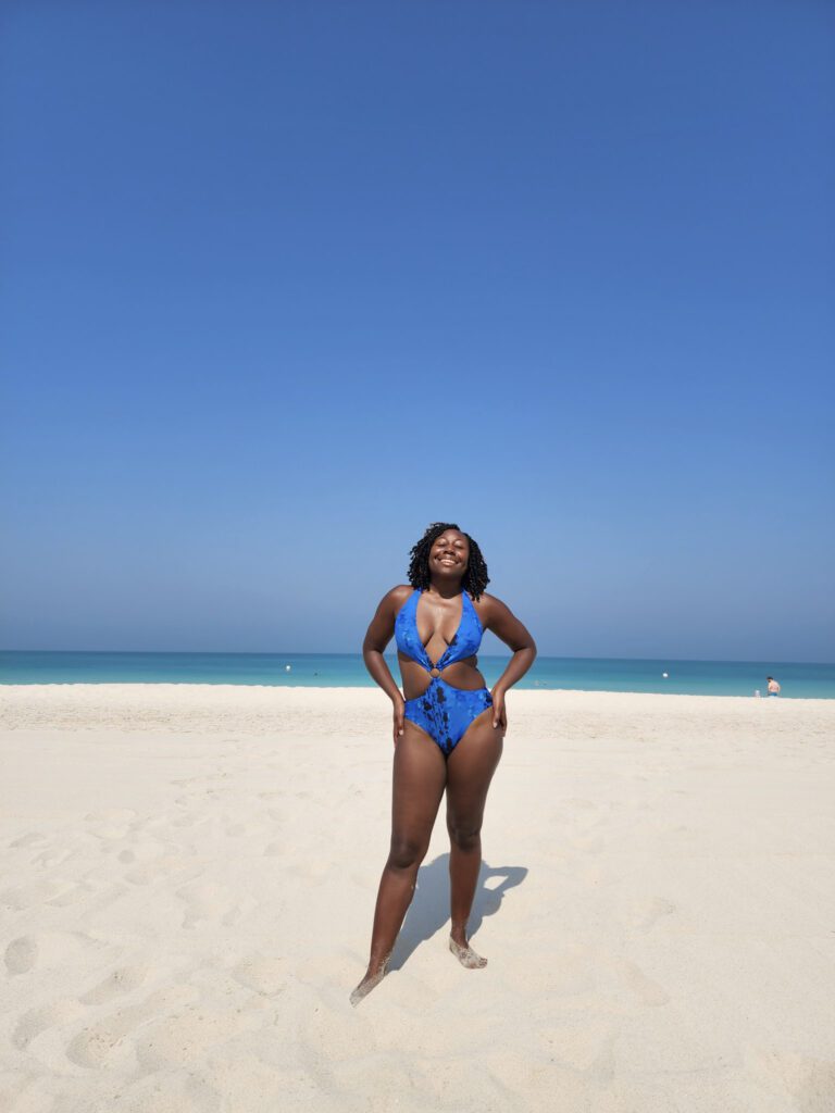 black woman smiling on beach