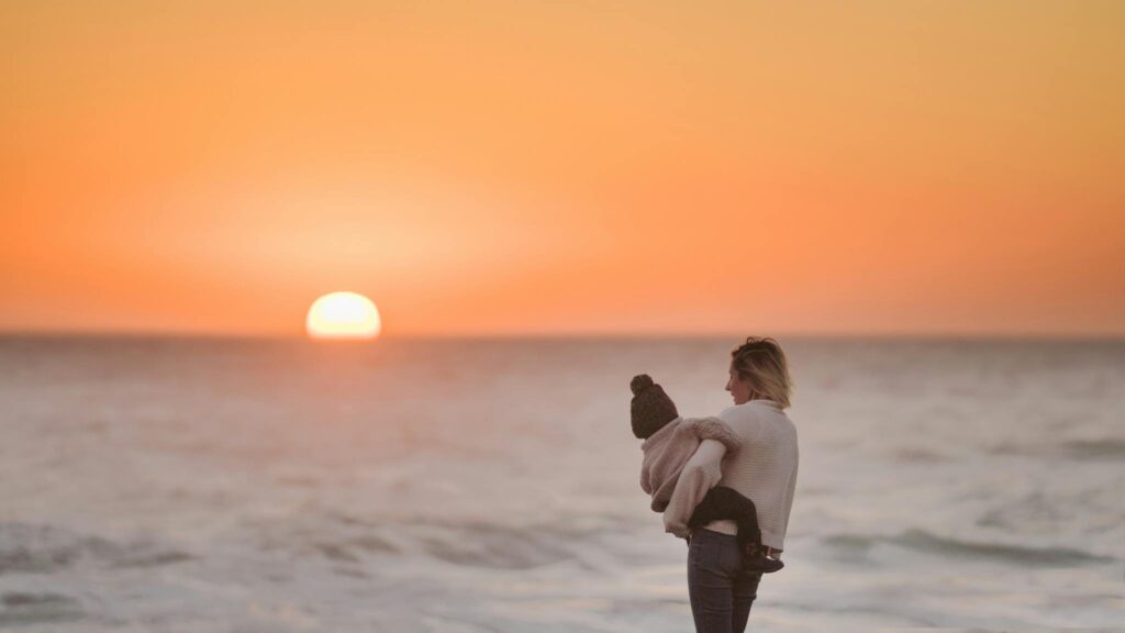 Photo Of Woman Carrying Toddler