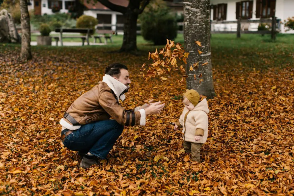 Photo Of Man Playing With Baby