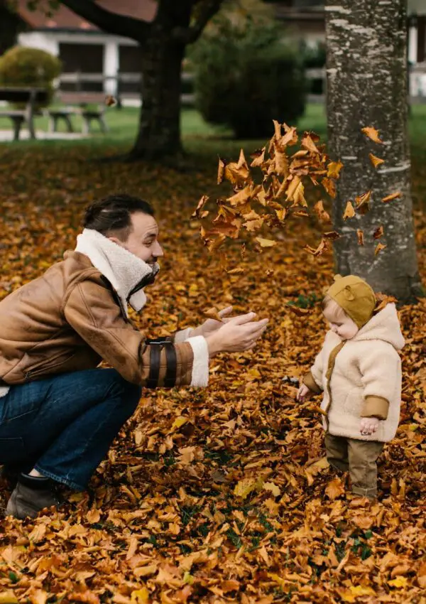 Photo Of Man Playing With Baby